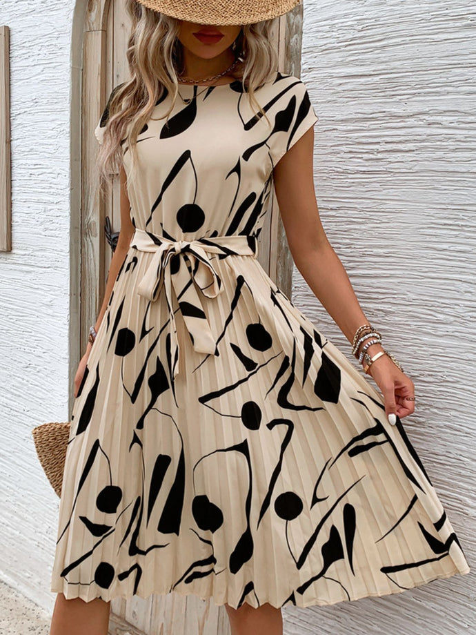 Embrace Summer Chic and Modern Femininity: How the Tied Pleated Printed Cap Sleeve Dress Elevates Timeless Wardrobe with Boutique Fashion Style Inspiration